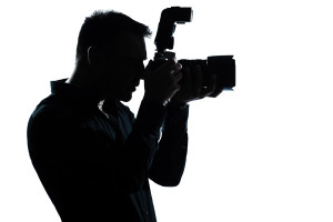 one caucasian man portrait silhouette photographer in studio isolated on white background